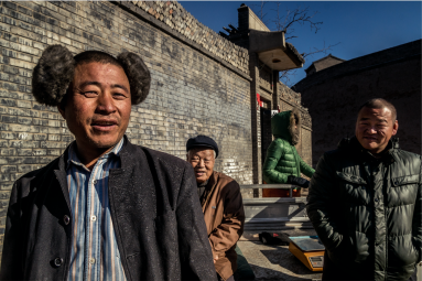 Pingyao locals selling walnuts in the street